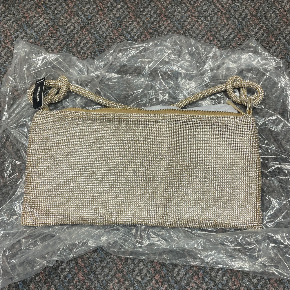 Express shimmering gold tone evening bag